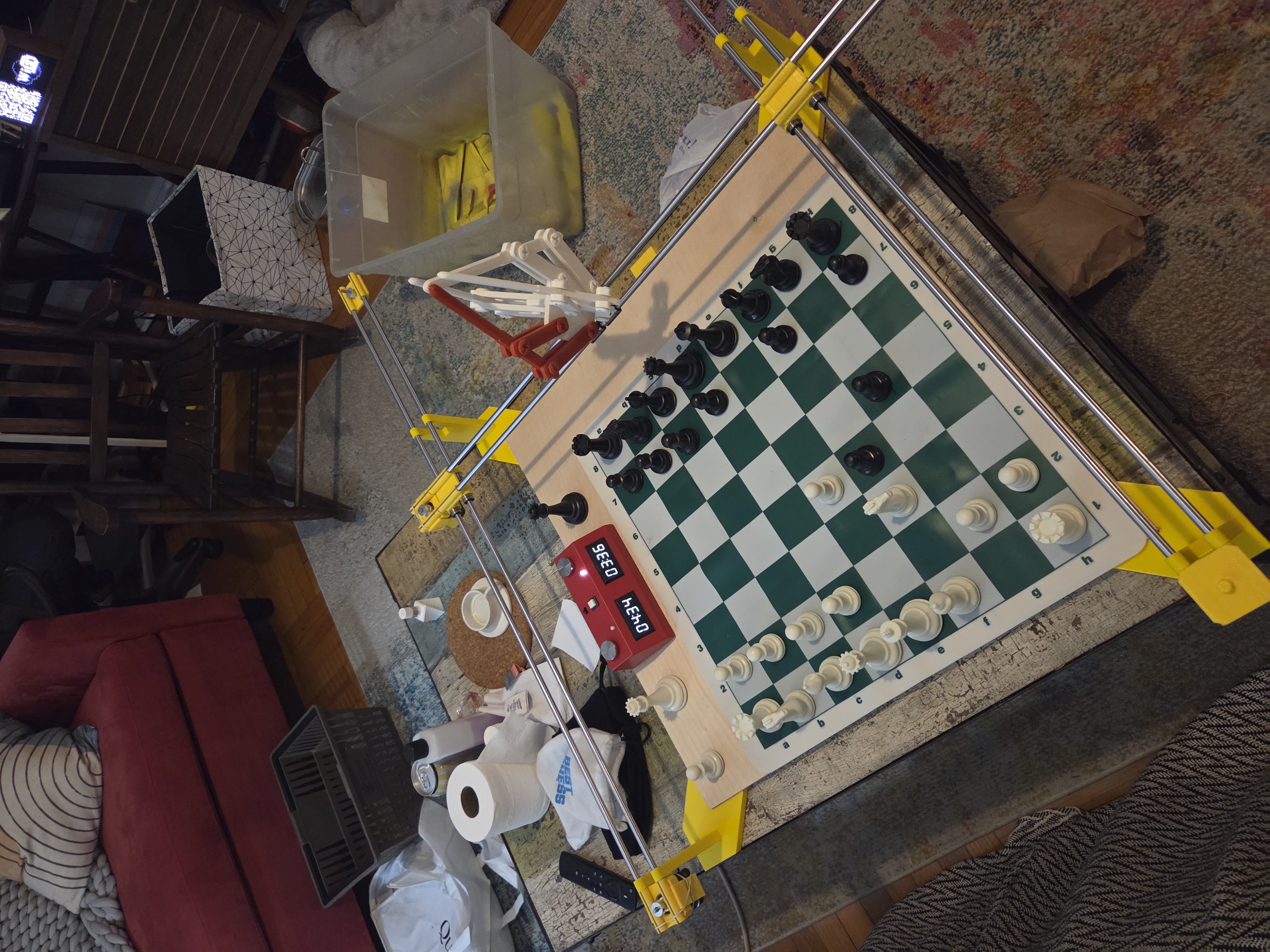 The Chess Robot prototype on my coffee table! (With a stand in for the end effector I made years ago)